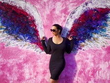 Christina Cindrich in front of angel wings on Melrose