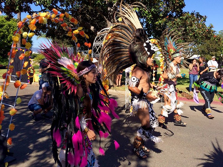 Aztec dance group Ketzaliztli perform during Dia de los Muertos at Woodlawn Cemetery