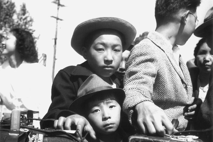 Dorothea Lange, “Young evacuees of Japanese ancestry wait their turn for baggage inspection, Turlock, CA,” 1942 [detail]. Gelatin silver print (printed later). Private collection; courtesy of Photographic Traveling Exhibitions.