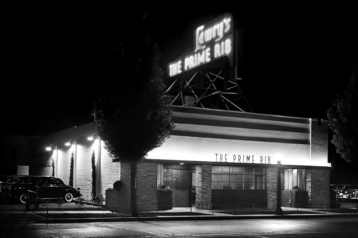Nighttime photo of Lawry's The Prime Rib at its original location in 1938