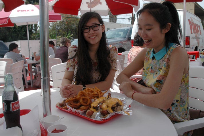 Susanna Niu and Sally Guo with their Pink’s hot dogs