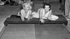 Marilyn Monroe and Jane Russell leave their handprints in the Forecourt of the Stars at the TCL Chinese Theatre