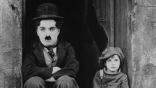 Charlie Chaplin and Jackie Coogan, publicity photo from “The Kid”