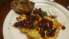 Fried eggs with chickpeas at Cooks County
