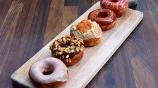 Flight of brioche donuts at The Strand House