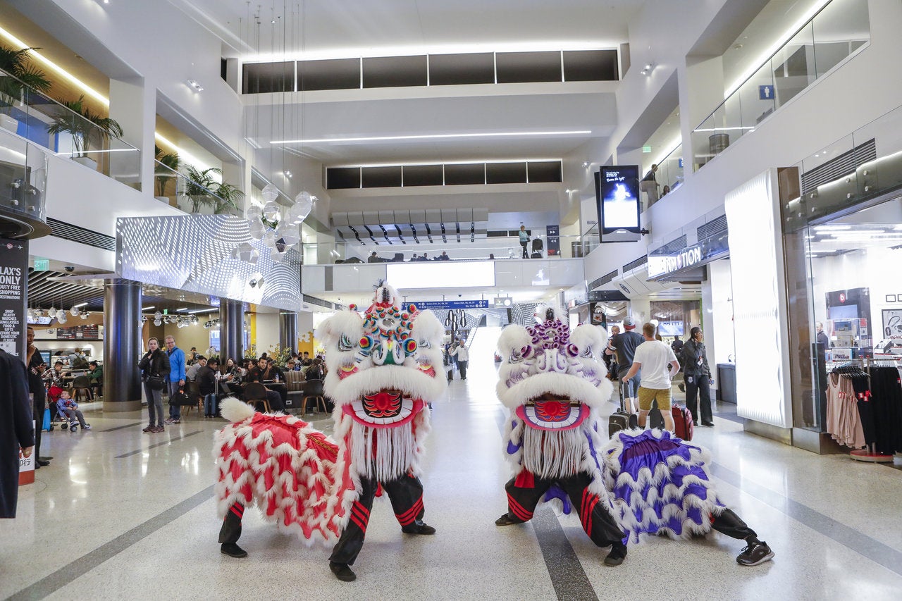 Lion dancers celebrate Lunar New Year at LAX Tom Bradley International Terminal