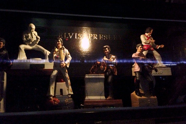 Elvis figurines in a glass case at the Formosa Café