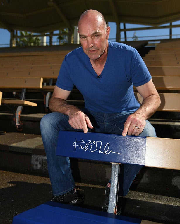 Kirk Gibson and his commemorative Home Run Seat at Dodger Stadium